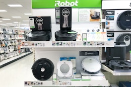 roomba vacuums sitting on a target shelf