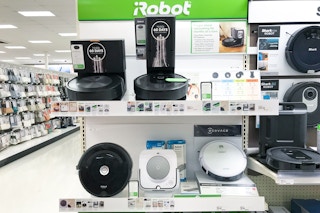 roomba vacuums sitting on a target shelf