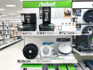 roomba vacuums mops sitting on a target shelf