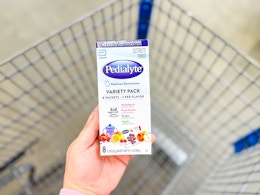 In-store photo taken of Pedialyte Electrolyte Powder (variety pack/8ct) held over Walmart shopping cart