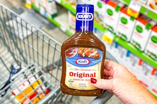 hand holding a bottle of kraft barbecue sauce
