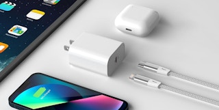 apple lightning plug and cord surrounded by devices