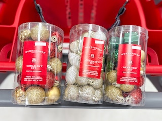 3 wondershop ornament 25-packs sitting on top a target cart