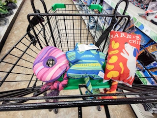 dollar tree cart with 3 dog toys sitting in the top