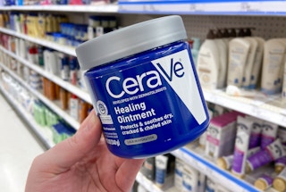 hand holding cerave healing ointment jar