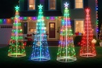 Minetom 7.5Ft Smart LED Christmas Cone Tree outside a house at night lit up.