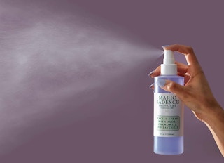Purple facial spray and mist on a purple background