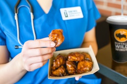 a nurse eating wings from buffalo wild wings