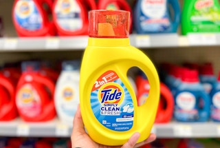 hand holding bottle of Tide Simply