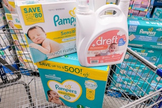 boxes of pampers wipes, diapers, and a jug of dreft detergent in a cart