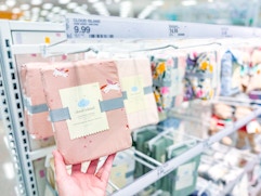 cloud island crib sheets sitting on a target shelf