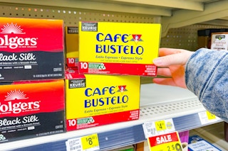 hand grabbing a box of cafe bustelo coffee k-cups