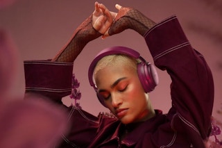 a woman wearing bose quietcomfort ultra headphones