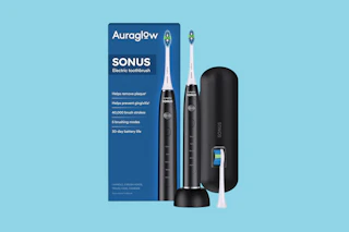 auraglow electric toothbrush on a blue background