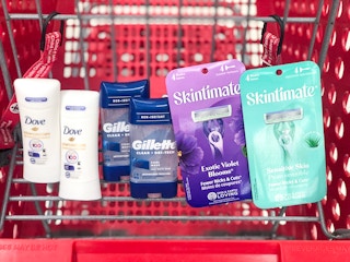 four bottles of deodorant and two packs of razors in shopping cart