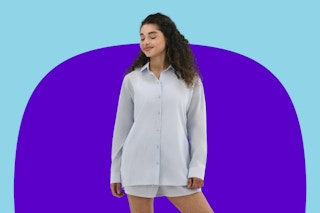 Stock image of woman wearing a No Boundaries oversized shirt and boxer set in blue