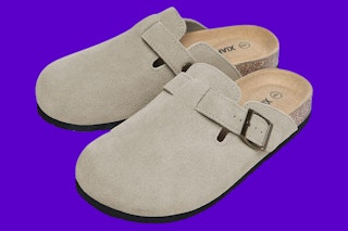 A pair of taupe suede-look buckled round-toe clogs
