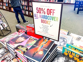 A book display with a sign that reads, "Limited Time Only, 50% off all hardcover books" at Barnes & Noble