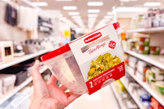 hand holding a rubbermaid serving bowl set in a target aisle