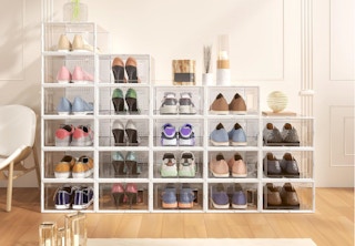 shoes in clear shoe boxes against a wall