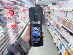 hand holding axe body wash in walgreens