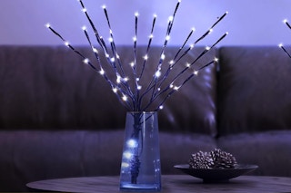 Brightown3 Pack Lighted Branches sitting on a living room coffee table.