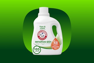 A white bottle of Arm & Hammer Free & Clear Detergent for sensitive skin washes 105 loads.