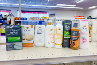 dove bar soaps and body washes on a shelf