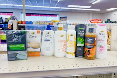 dove bar soaps and body washes on a shelf