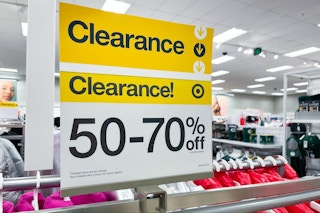 a sign of 50% to 70% clearance signage in the apparel department at target
