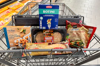 popcorn shrimp, rotini pasta, chicken patties, garlic bread, and frozen veggies in a cart