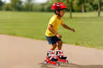 Lifestyle image of a small child wearing/using the Halo Inline Skates Combo Set outdoors