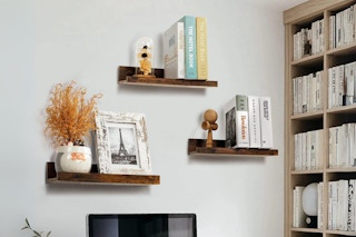 Three Walmart floating shelves in a home office setting