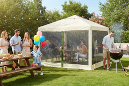 people in and around the Ozark Trail screenhouse during a party