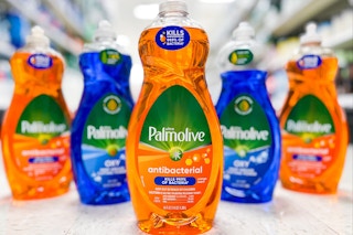 5 palmolive dish soap bottles sitting on the floor in a target aisle