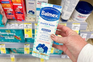 person holding a box of balmex diaper rash cream