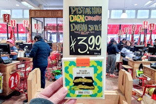 hand holding dubai chocolate bar