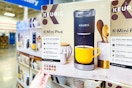 hand holding a keurig k-mini coffee maker