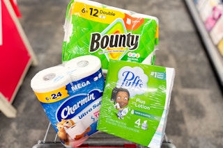 charmin, bounty, and puffs paper products in a cart