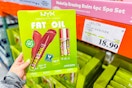 hand holding a nyx fat oil 3-pack next to price tag at costco