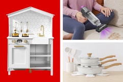 white play kitchen, black and purple handheld vacuum, white cookware set