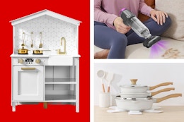 white play kitchen, black and purple handheld vacuum, white cookware set