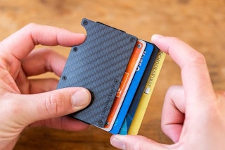 Person holding RFID Blocking Metal Wallet with cards inside