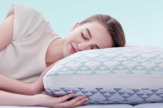 woman resting head on pillow