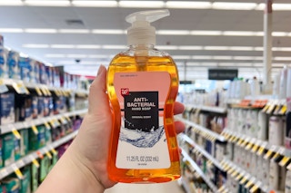 hand holding a bottle of Walgreens-brand hand soap