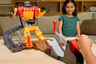 child playing with Monster Jam playset