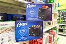 2 oster toasters sitting on a target shelf