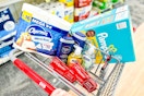 charmin toilet paper, pampers diapers, nivea body wash, softsoap hand soap, and colgate toothpaste in a cart