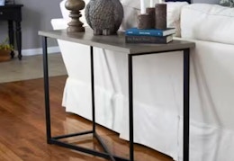 console table behind a couch