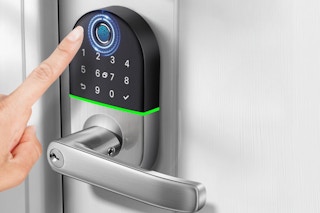 Person using the NICE DIGI Keyless Entry Fingerprint Lock.